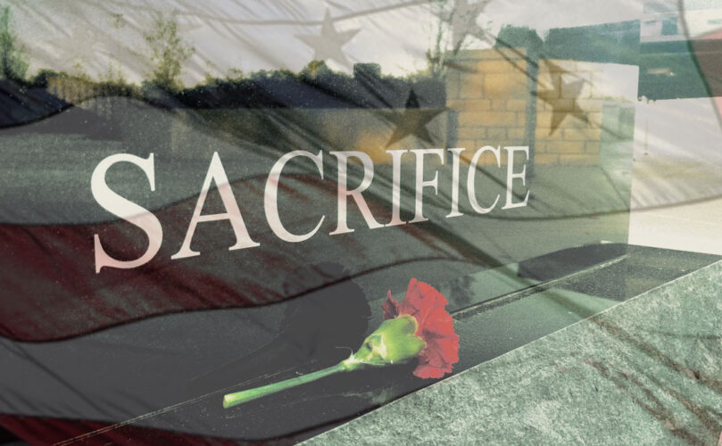 An image of a monument that says 'sacrifice'