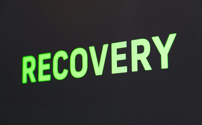 an image of the word recovery in green letters with black background
